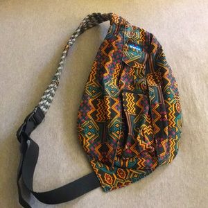 Kavu cross body back pack Aztec design orange turquoise pink and black colors